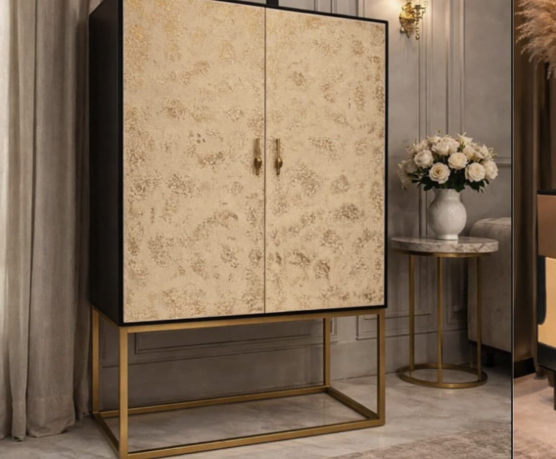 Solace cabinet in cream burl veneer on a brass frame