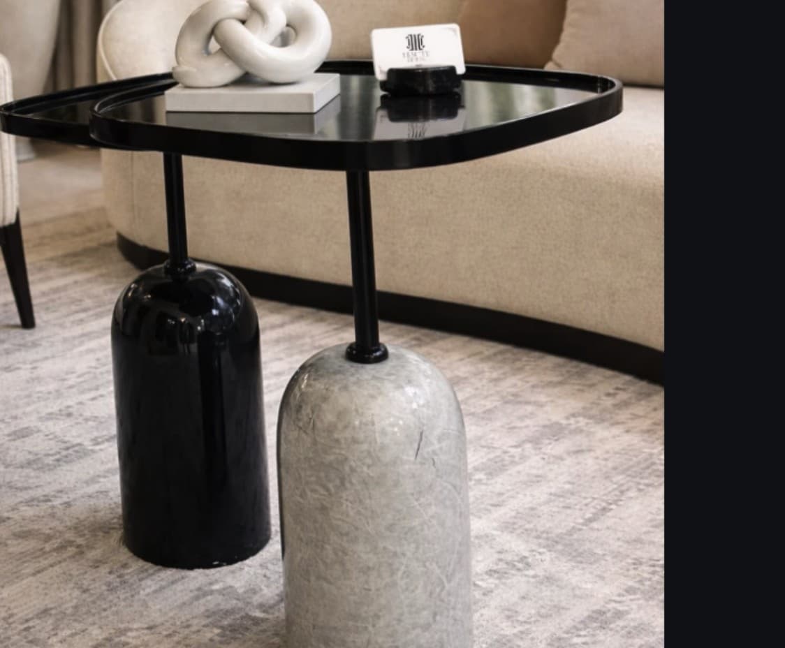 Onyx round side table in black with sculptural base